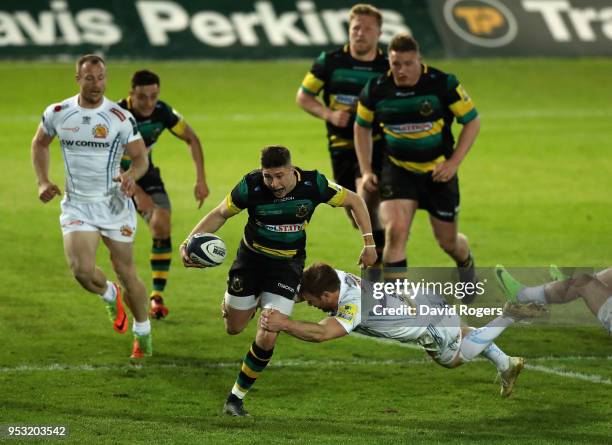 James Grayson of Northampton is tackled by Will Chudley during the Aviva A League Final between Northampton Wanderers and Exeter Braves at Franklin's...