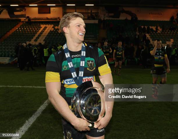 Tom Stephenson the Northampton Wanderers captain holds the trophy as he celebrates their victory during the Aviva A League Final between Northampton...