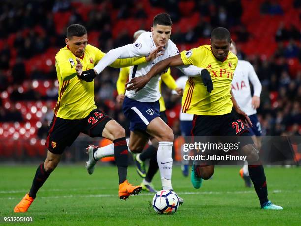 Erik Lamela of Tottenham Hotspur holds off Jose Holebas and Christian Kabasele of Watford during the Premier League match between Tottenham Hotspur...