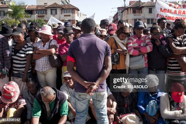 Opposition supporters listen to speeches delivered by opposition activists in May 13 Square during an anti-government demonstration, in Antananarivo...