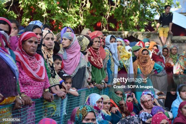 Kashmiri women mourns while watching the Funeral procession of Shahid Ahmed at his residence Arihal Village in south Kashmir's Pulwama District on...