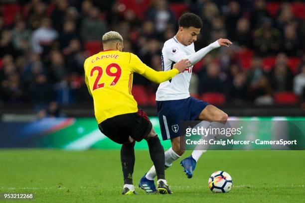 Tottenham Hotspur's Dele Alli vies for possession with Watford's Etienne Capoue during the Premier League match between Tottenham Hotspur and Watford...