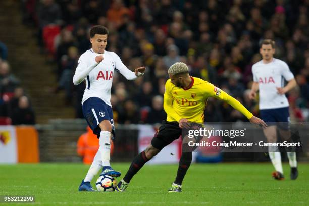 Tottenham Hotspur's Dele Alli vies for possession with Watford's Etienne Capoue during the Premier League match between Tottenham Hotspur and Watford...