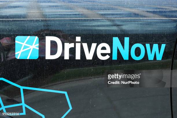 The logo of carsharing service wholly owned by the automotive manufacturer BMW DriveNow is seen on a car in Munich.