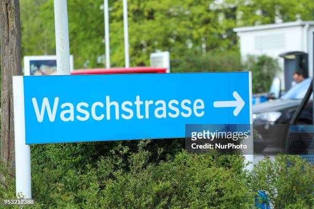 Sign with written &quot;Waschstraße&quot; is seen in Munich at a filling Station of Aral.