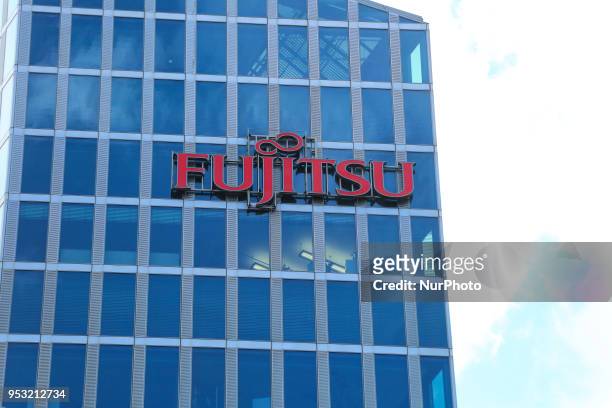 The logo of Japanese multinational information technology equipment and services company Fujitsu is seen on a skyscraper in Munich.