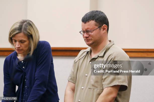 Devin Richardson-Gurney reacts during his initial court appearance for an alleged charge of arson at the historic Casco schoolhouse. His lawyer is...