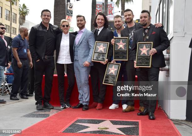 Carson Daly and Ellen DeGeneres attend the ceremony as Lance Bass, JC Chasez, Joey Fatone, Justin Timberlake and Chris Kirkpatrick of NSYNC are...
