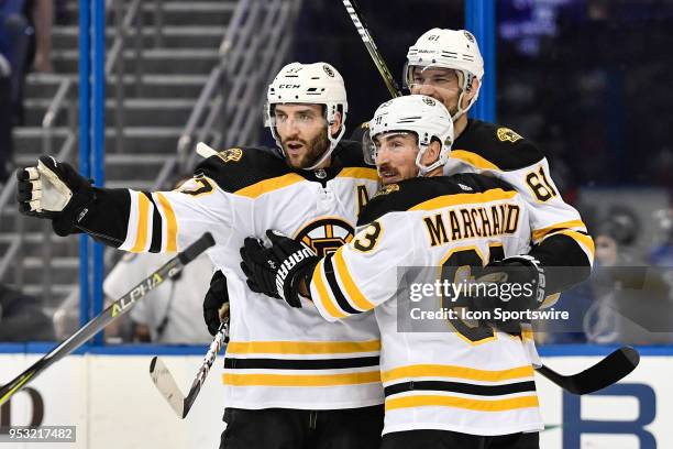 Boston Bruins left wing Rick Nash celebrates his power play goal with his Boston Bruins center Patrice Bergeron and Boston Bruins left wing Brad...