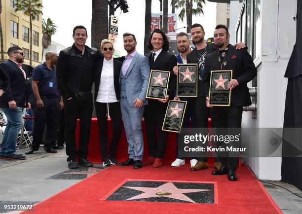 Carson Daly and Ellen DeGeneres attend the ceremony as Lance Bass, JC Chasez, Joey Fatone, Justin Timberlake and Chris Kirkpatrick of NSYNC are...