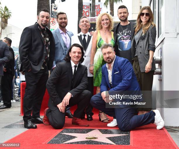 Chris Kirkpatrick, Joey Fatone, Justin Timberlake, JC Chasez and Lance Bass of NSYNC pose with family during the ceremony honoring NSYNC with a star...