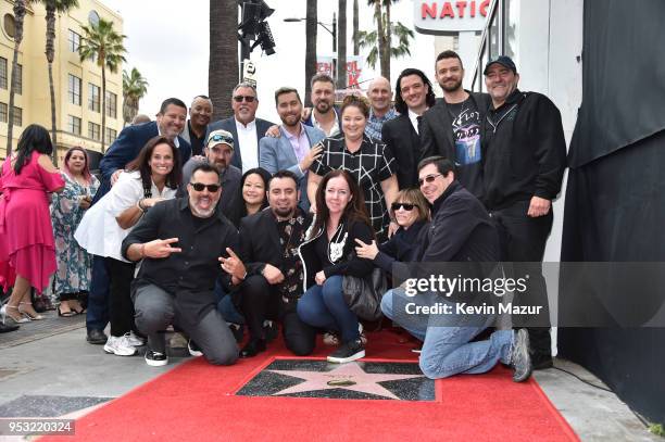 Chris Kirkpatrick, Joey Fatone, Justin Timberlake, JC Chasez and Lance Bass of NSYNC pose with family during the ceremony honoring NSYNC with a star...