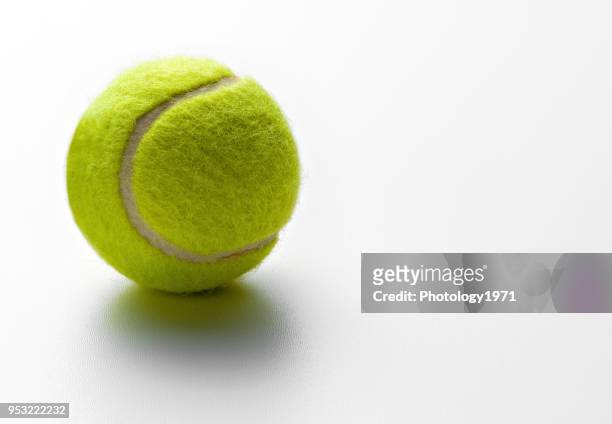 close-up of tennis ball on white background - tennis photos et images de collection