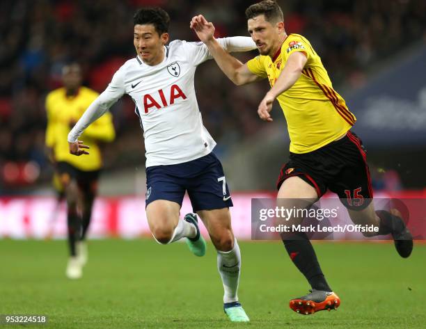 Heung-Min Son of Tottenham and Craig Cathcart of Watford during the Premier League match between Tottenham Hotspur and Watford at Wembley Stadium on...