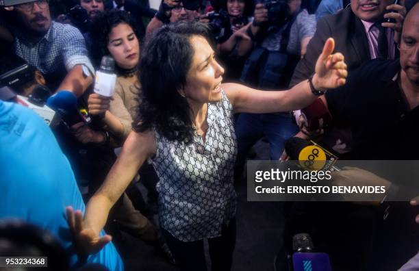 The wife of Peru's former President Ollanta Humala, Nadine Heredia, is hounded by the press upon arrival at her house after being in preventative...