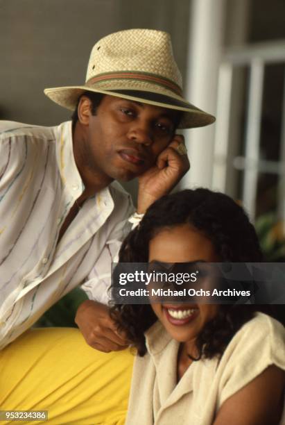 Musician Norman Connors poses for a portrait session with a woman for Right-On Magazine at home in circa 1976.