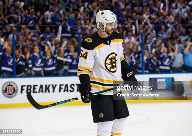 Adam McQuaid of the Boston Bruins reacts to giving up a goal to the Tampa Bay Lightning during Game Two of the Eastern Conference Second Round during...