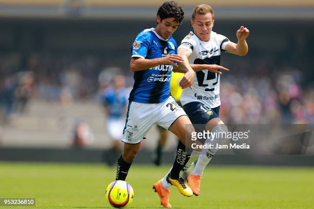 Jaime Gomez of Queretaro and Marcelo Diaz of Pumas compete for the ball during the 17th round match between Pumas UNAM and Queretaro as part of the...
