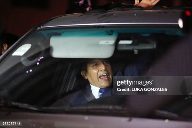 Peru's former President Ollanta Humala gestures in a car after being released from preventative detention awaiting trial on charges of money...