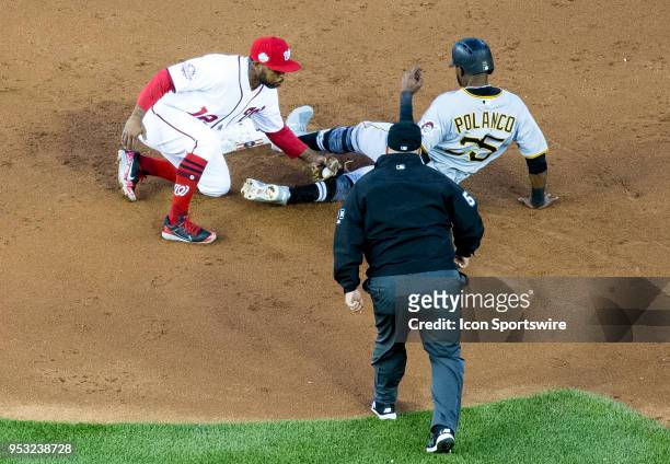 Washington Nationals left fielder Howie Kendrick tags Pittsburgh Pirates right fielder Gregory Polanco at second during a MLB game between the...