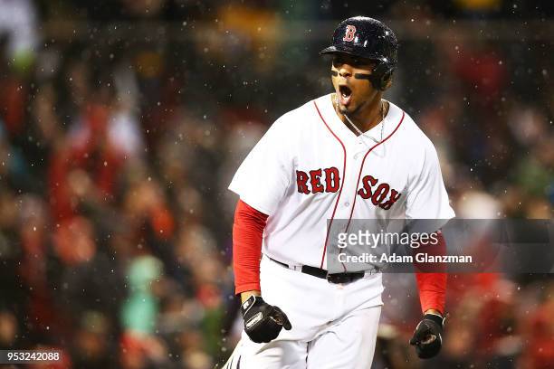 Xander Bogaerts of the Boston Red Sox reacts as he rounds the bases after hitting a grand slam in the third inning of a game against the Kansas City...