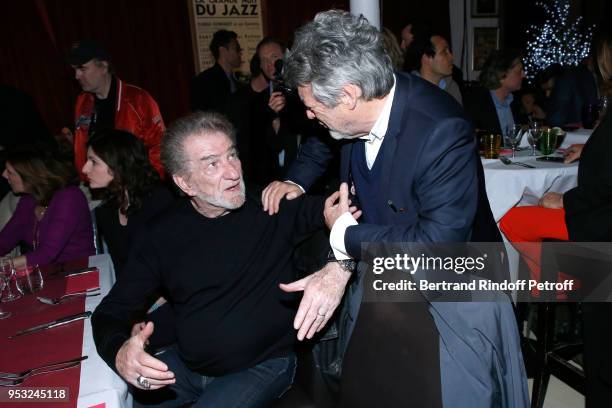 Eddy Mitchell and Jean-Louis Borloo attend the Dinner in honor of Nathalie Baye at La Chope des Puces on April 30, 2018 in Saint-Ouen, France.