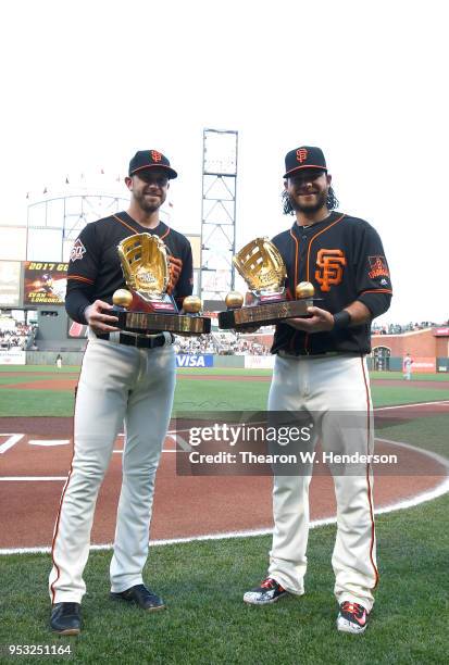 Evan Longoria and Brandon Crawford of the San Francisco Giants both Rawlings Gold winners from the 2017 season was presented with their gold glove...