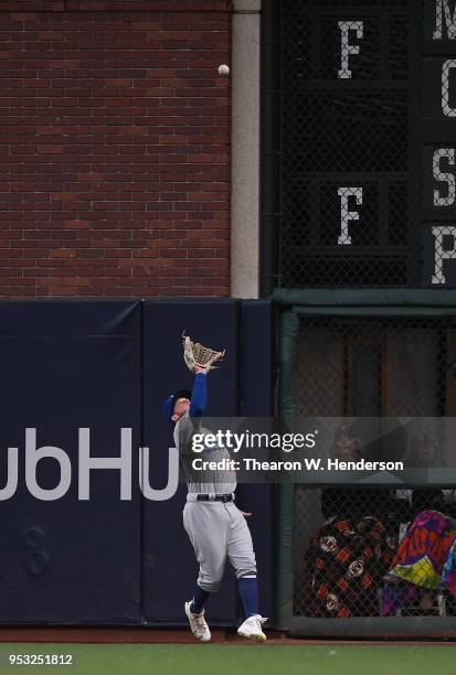 Alex Verdugo of the Los Angeles Dodgers catches a fly ball off the bat of Buster Posey of the San Francisco Giants in the bottom of the first inning...