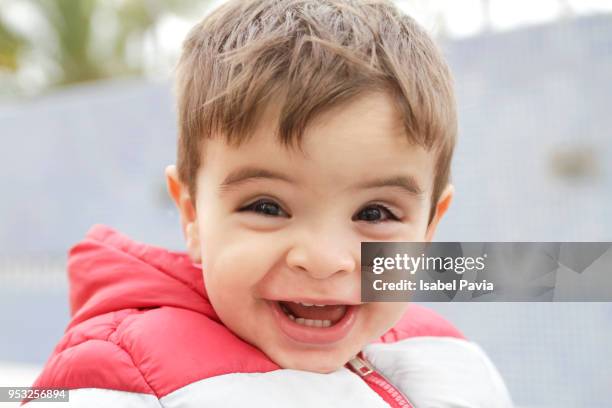 portrait of happy baby boy smiling to camera - isabel pavia stock pictures, royalty-free photos & images