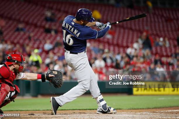 Domingo Santana of the Milwaukee Brewers doubles to center field to drive in two runs for the lead against the Cincinnati Reds in the seventh inning...