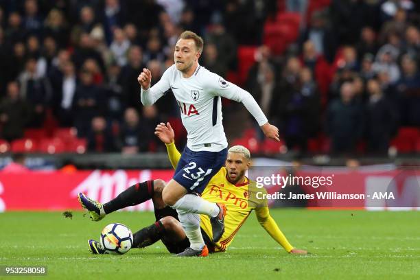 Christian Eriksen of Tottenham and Etienne Capoue of Watford during the Premier League match between Tottenham Hotspur and Watford at Wembley Stadium...