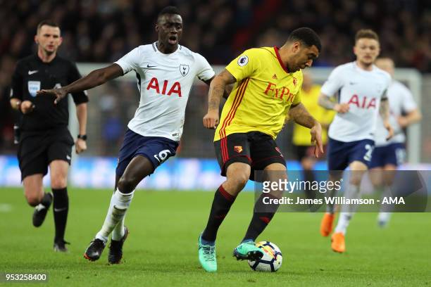 Davinson Sanchez of Tottenham and Troy Deeney of Watford during the Premier League match between Tottenham Hotspur and Watford at Wembley Stadium on...