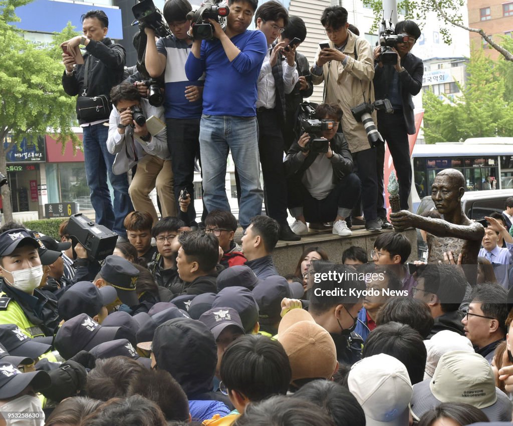 Korean Laborers Labor group members and police officers square off near the Japanese ...