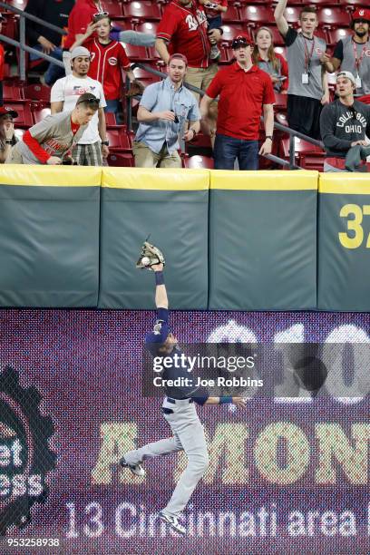 Christian Yelich of the Milwaukee Brewers makes a leaping catch in front of the wall in left field in the sixth inning of a game against the...