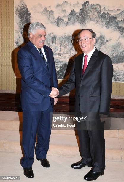 Chinese Vice President Wang Qishan shakes hand with Dominican Republic's Chancellor Miguel Vargas at the Zhongnanhai Leadership Compound on May 1,...