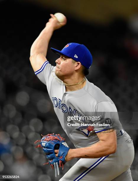 Roberto Osuna of the Toronto Blue Jays delivers a pitch against the Minnesota Twins during the ninth inning of the game on April 30, 2018 at Target...