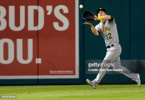 Pittsburgh Pirates left fielder Corey Dickerson makes a catch in far left field during a MLB game between the Washington Nationals and the Pittsburgh...