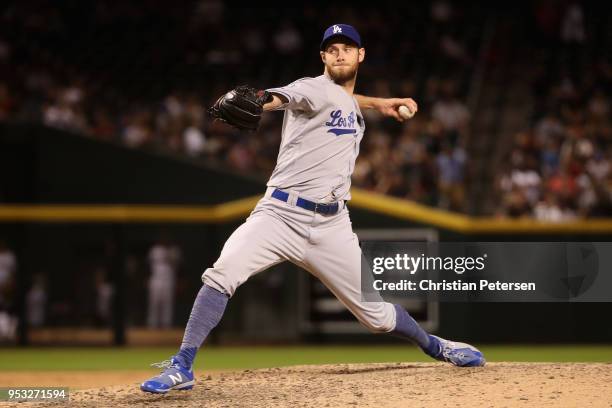 Relief pitcher Tony Cingrani of the Los Angeles Dodgers pitches against the Arizona Diamondbacks during the seventh inning of the MLB game at Chase...