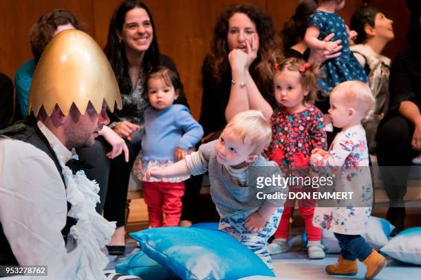 The character Pulcino, played by Timothy Connor, performs for children and their parents during the presentation of BambinO on April 30, 2018 at the...