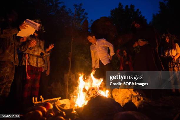 Participants pray during the Beltane feast of Fire next to Krakau Mound in Krakow. The Beltane Fire Festival is an annual participatory arts event...