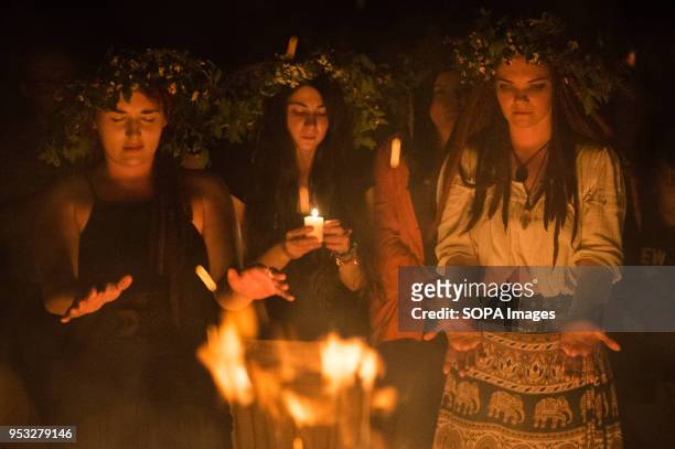 Participants participate in a ritual during the Beltane feast of Fire next to Krakau Mound in Krakow. The Beltane Fire Festival is an annual...