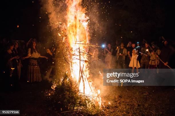 Participants participate in a ritual during the Beltane feast of Fire next to Krakau Mound in Krakow. The Beltane Fire Festival is an annual...