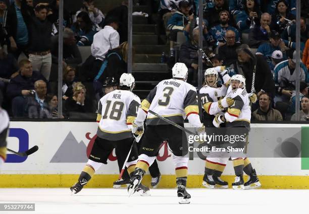 William Karlsson of the Vegas Golden Knights is congratulated by Jonathan Marchessault, James Neal, and Brayden McNabb of the Vegas Golden Knights...
