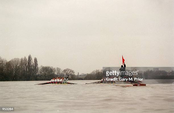 Umpire Rupert Obholzer stops the race as the two boats collide with each other during the 147th University Boat Race between Cambridge and Oxford...
