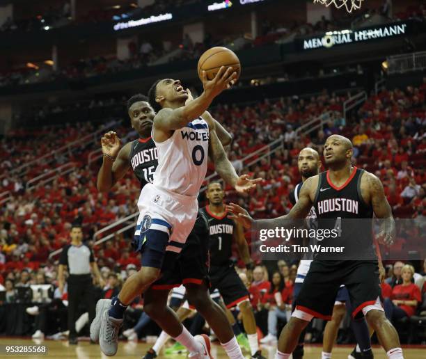 Jeff Teague of the Minnesota Timberwolves goes up for a shot defended by Clint Capela of the Houston Rockets in the second half during Game Five of...