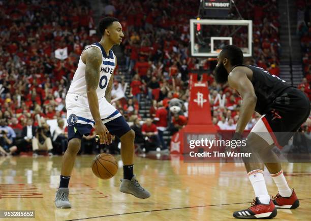 Jeff Teague of the Minnesota Timberwolves dribbles the ball defended by James Harden of the Houston Rockets in the second half during Game Five of...