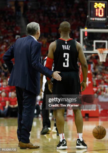 Head coach Mike D'Antoni of the Houston Rockets talks to Chris Paul in the second half during Game Five of the first round of the 2018 NBA Playoffs...