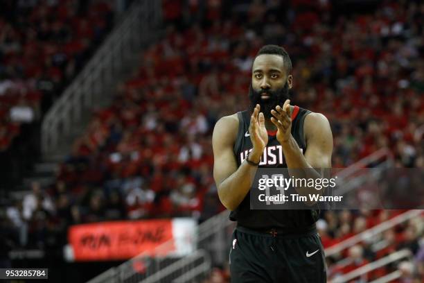 James Harden of the Houston Rockets reacts in the second half during Game Five of the first round of the 2018 NBA Playoffs against the Minnesota...