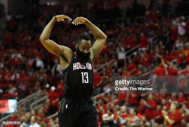 James Harden of the Houston Rockets reacts in the second half during Game Five of the first round of the 2018 NBA Playoffs against the Minnesota...