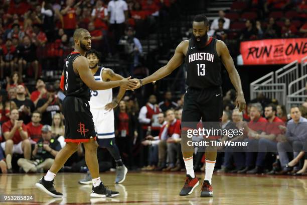 Chris Paul of the Houston Rockets congratulates James Harden in the second half during Game Five of the first round of the 2018 NBA Playoffs against...